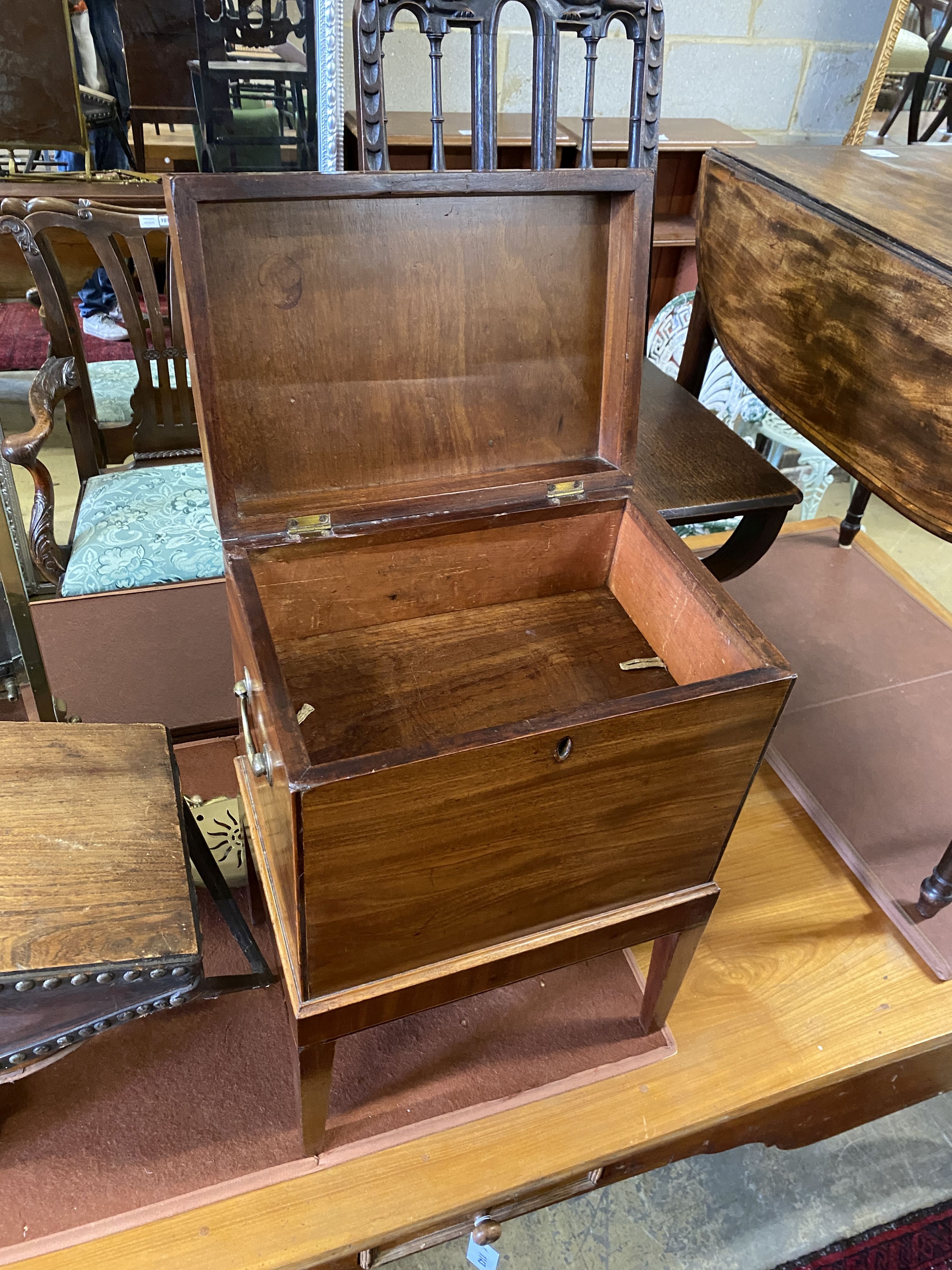 A George III mahogany cellarette, raised on square tapered legs, width 38cm, depth 27cm, height 56cm